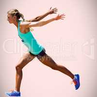 Composite image of sportswoman finishing her run