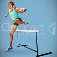 Composite image of sportswoman practising the hurdles