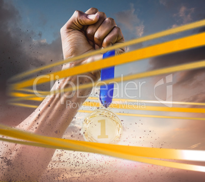 Composite image of hand holding a silver medal on white backgrou