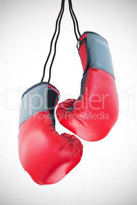 Boxing gloves attached to white background