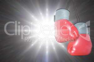 Boxing gloves attached to white background