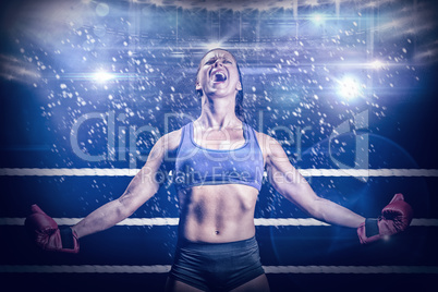Composite image of winning fighter with arms outstretched