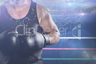 Composite image of mid section of muscular boxer