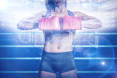 Composite image of midsection of boxer flexing stance