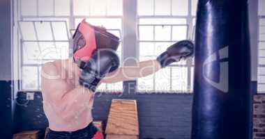 Composite image of side view of boxer hitting straight