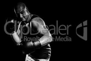 Composite image of boxer performing boxing stance