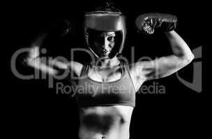 Composite image of portrait of confident female fighter flexing