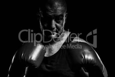 Composite image of boxer performing boxing stance
