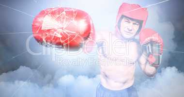 Composite image of boxer punching against black background