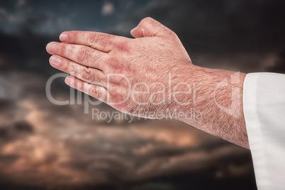 Composite image of close-up of karate fighter making hand gestur