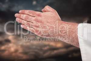 Composite image of close-up of karate fighter making hand gestur