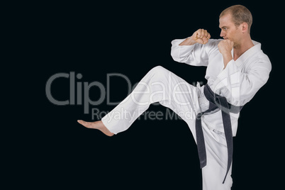 Composite image of fighter performing karate stance