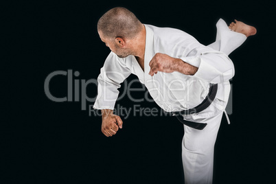 Composite image of fighter performing karate stance