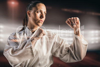 Composite image of female fighter performing karate stance