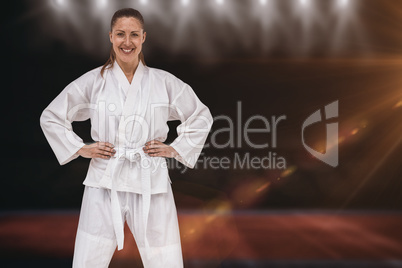 Composite image of female fighter standing with hand on hip