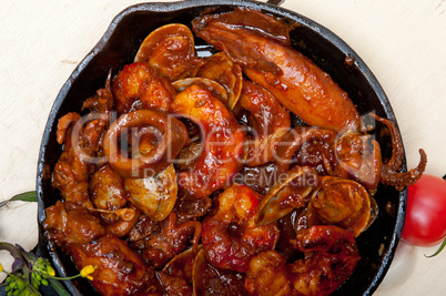 fresh seafoos stew on an iron skillet