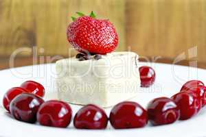 ripe red berries of strawberry cherry and cake on the plate