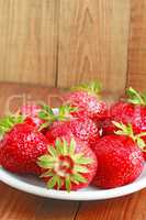 ripe red strawberries on the plate