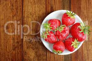 ripe red strawberries on the plate