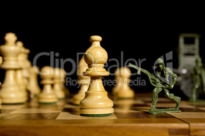 Chess pieces and toy soldiers