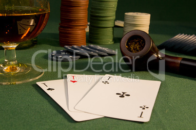 Poker concept with cards on green table