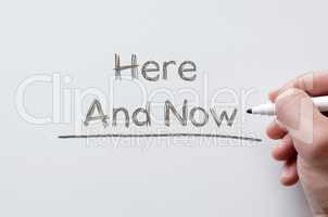 Here and now written on whiteboard