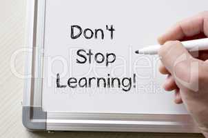 Don't stop learning written on whiteboard