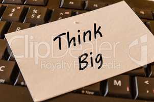 Think big concept on keyboard background