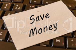 Save money concept on keyboard background
