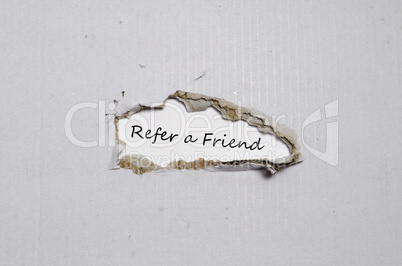 The word refer a friend appearing behind torn paper.