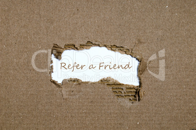 The word refer a friend appearing behind torn paper.