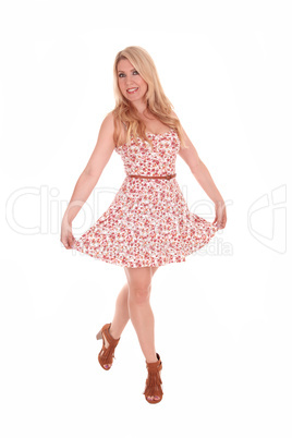Beautiful blond woman in summer dress.