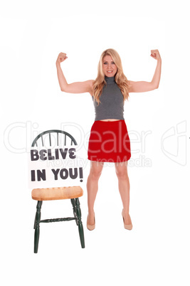 Gorgeous woman with sign "believe in you".