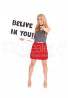 Lovely young woman with sign "believe in you".