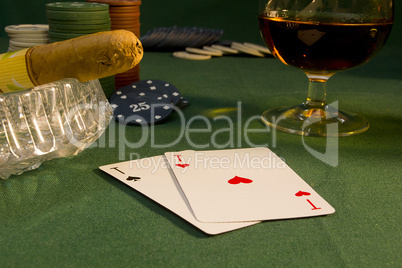 Poker concept with cards on green table