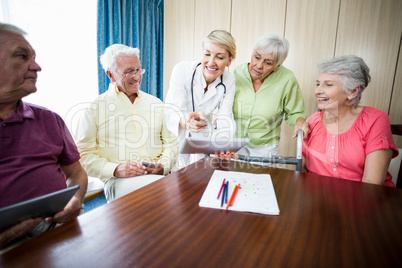 Nurse showing seniors something