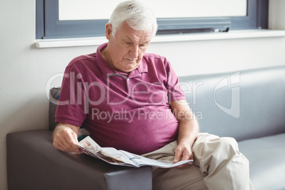 Senior man reading the newspaper