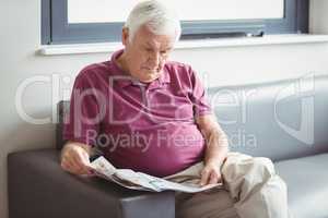 Senior man reading the newspaper