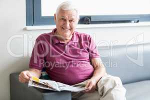 Senior man reading the newspaper