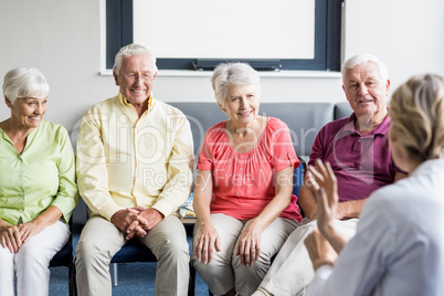 Seniors listening to nurse