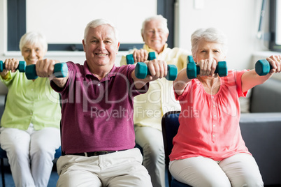 Seniors using weights