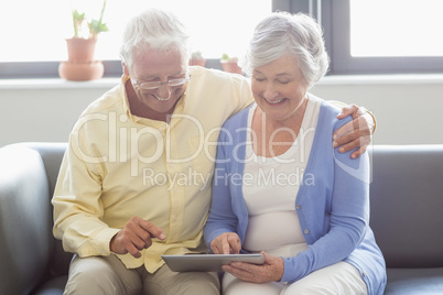 Senior couple using a tablet