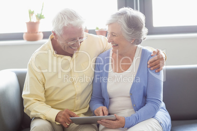 Senior couple using a tablet