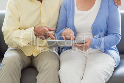 Senior couple using a tablet