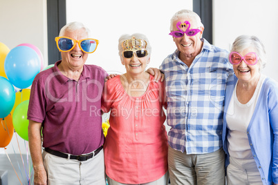 Seniors wearing funny glasses