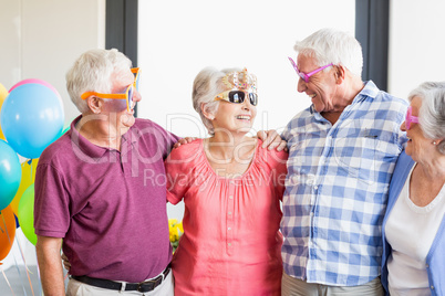 Seniors wearing funny glasses