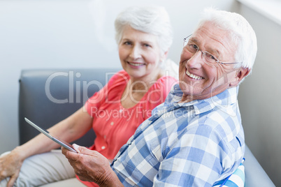 Senior couple using tablet