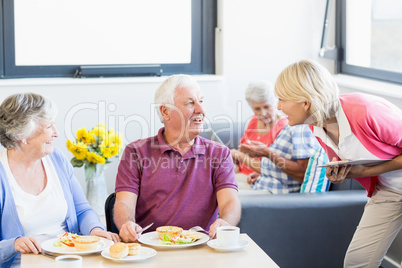 Nurse talking to seniors