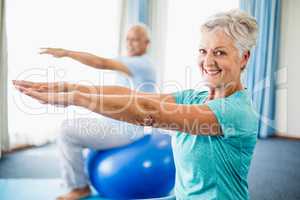 Seniors using exercise ball