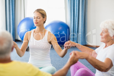 Seniors performing yoga